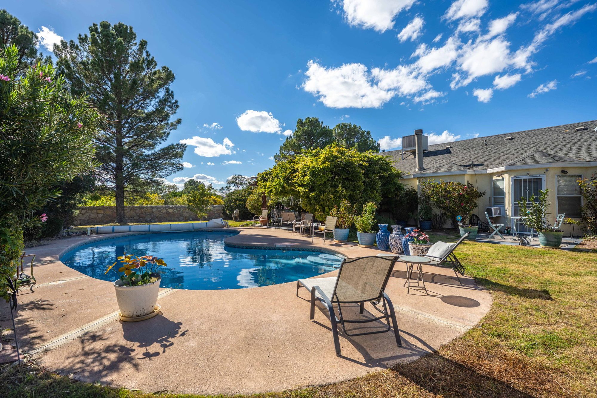 In-ground pool and backyard at 4923 S South Fork Road