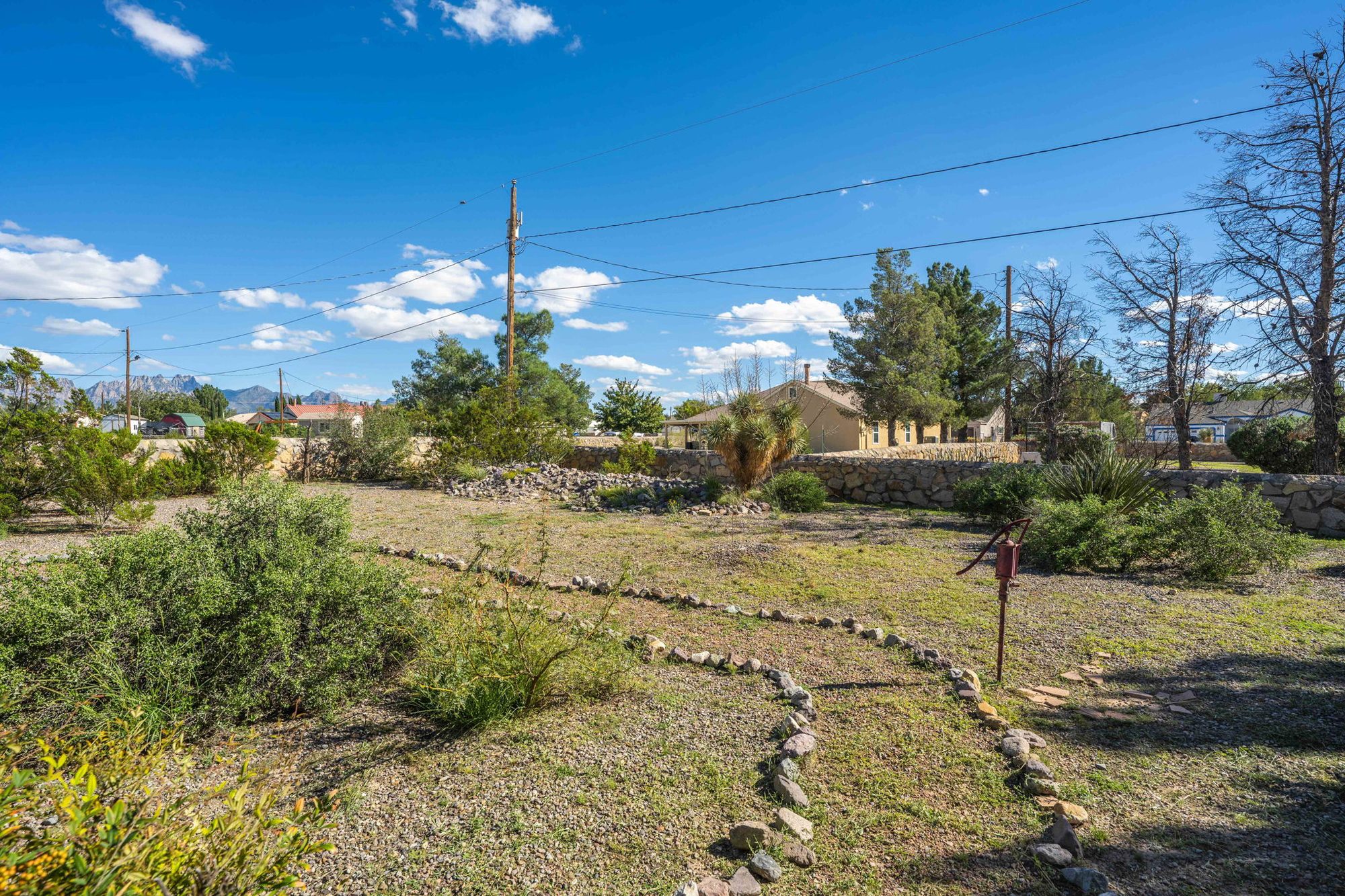 Rock-lined garden paths and stone wall