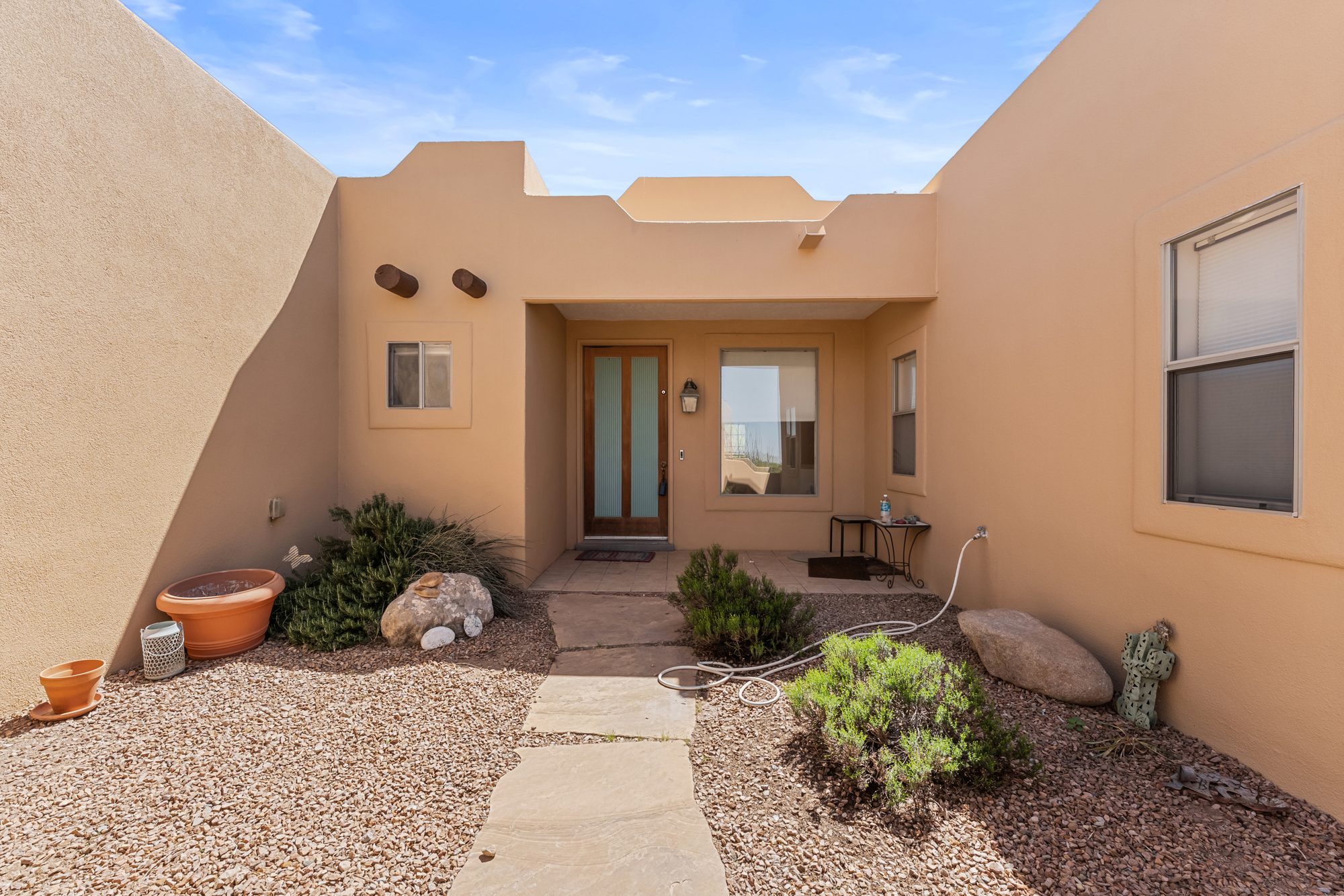 Interior courtyard entry with adobe walls