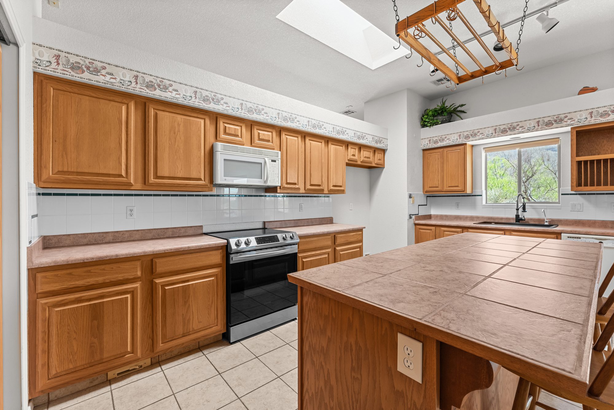 Kitchen with skylight and range