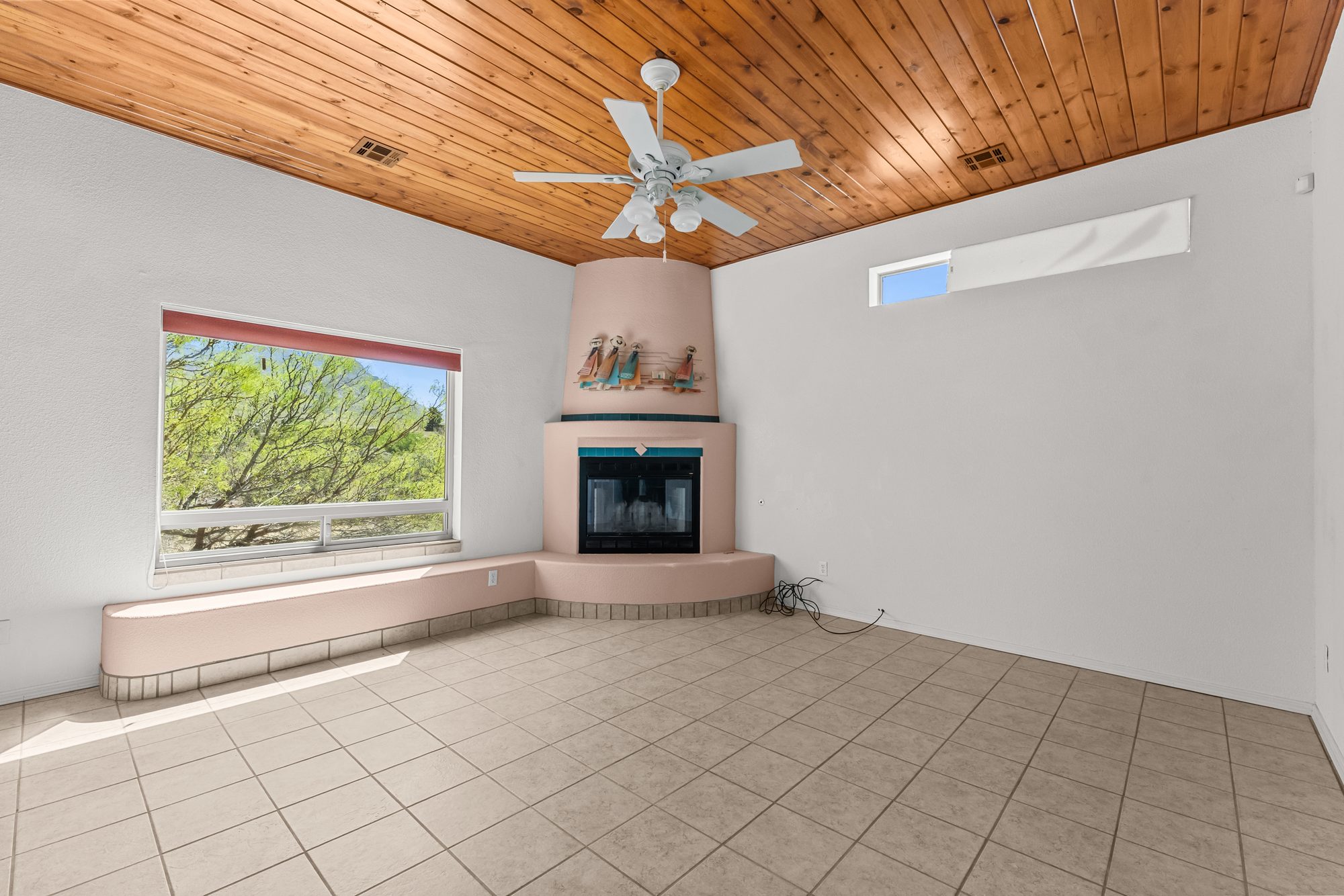 Great room with adobe kiva fireplace