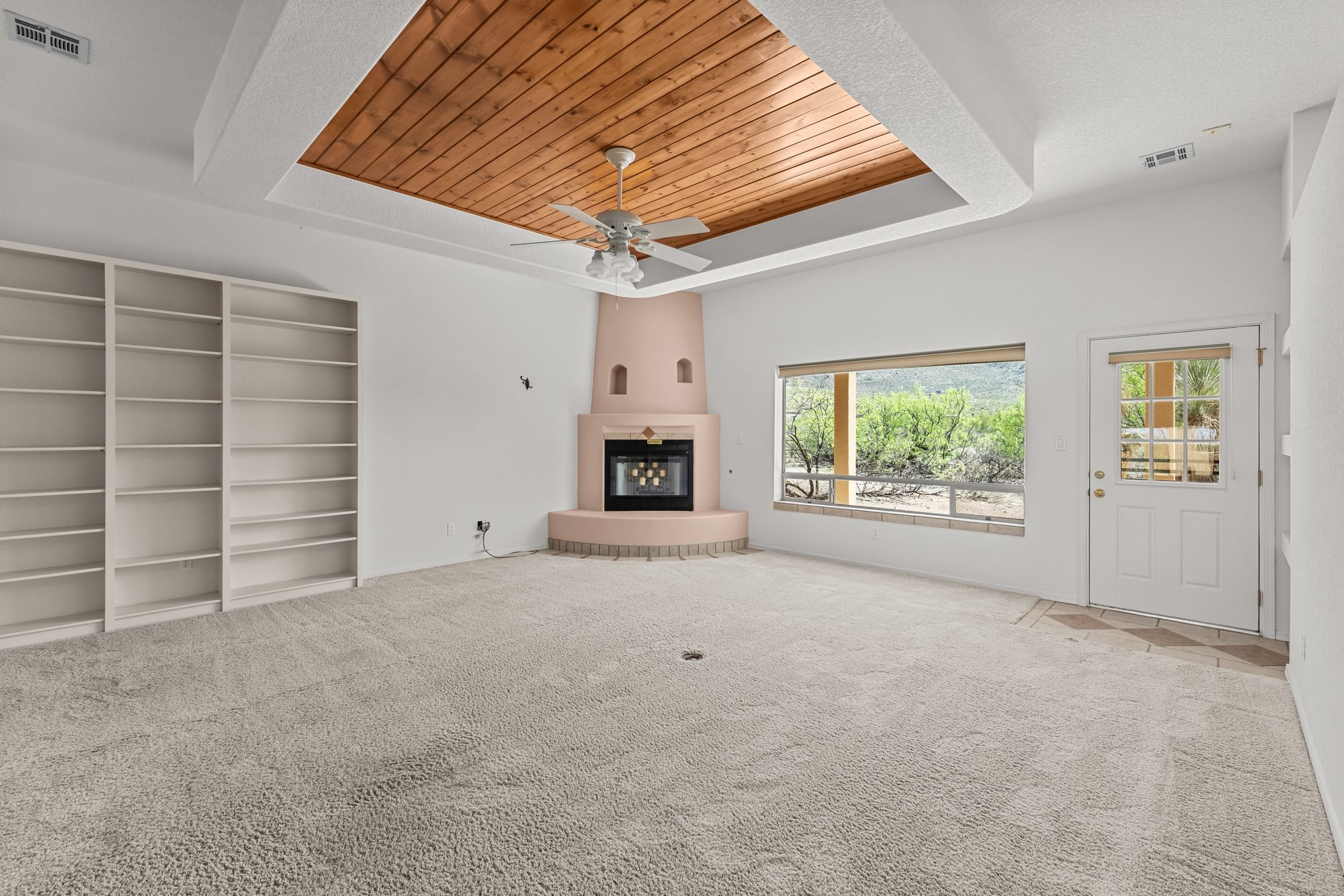 Second living room with kiva fireplace and built-ins