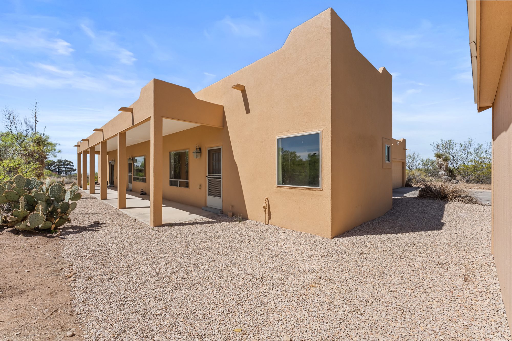 Covered portal along the adobe exterior